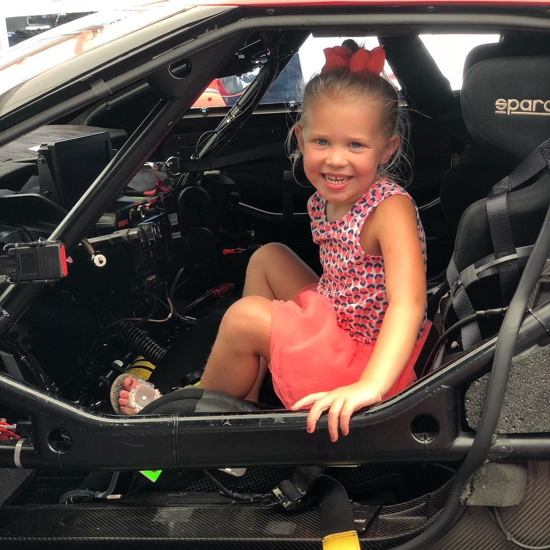 Finley sneaking into daddy's race car after a racing event